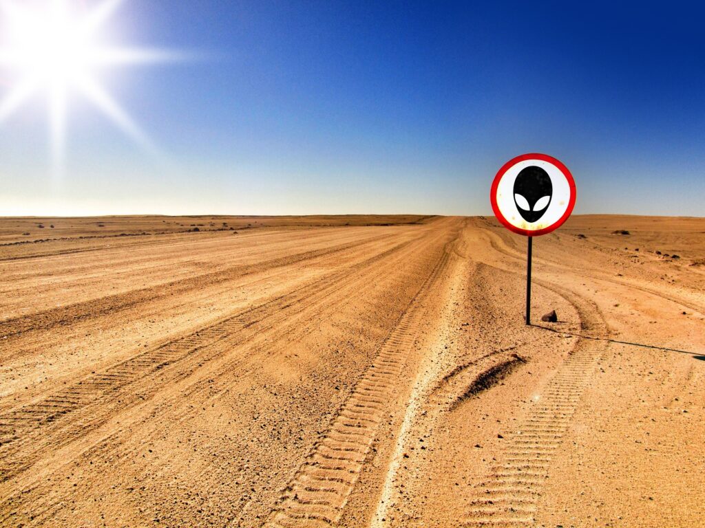 Sand road with sign UFO/Alient is ahead